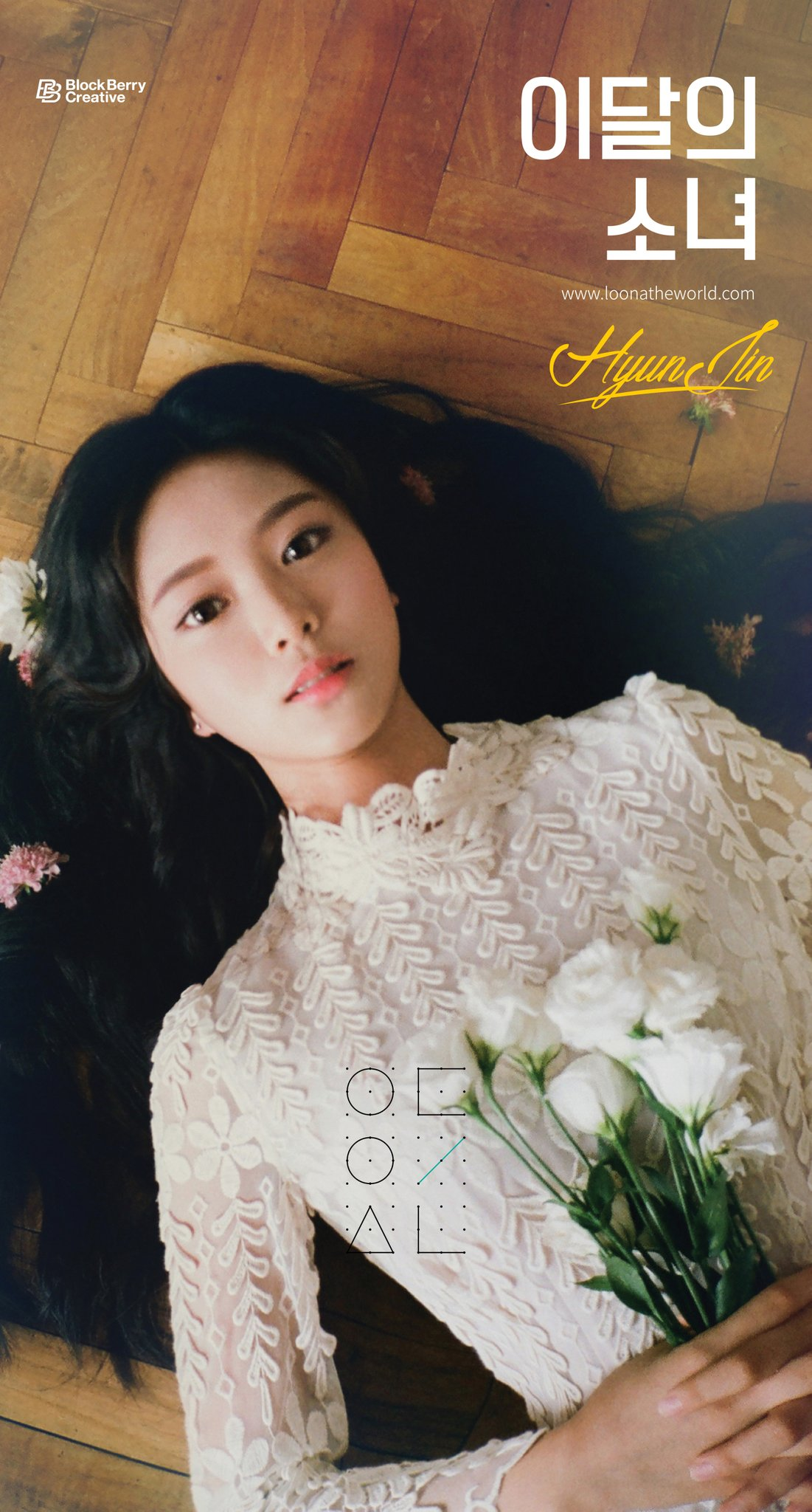 Hyunjin laying on the ground with flowers.